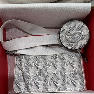 CHRISTIAN LOUBOUTIN LOUBILA HYBRID MONOGRAM
POUCH CROSSBODY BAG IN WHITE/BLACK